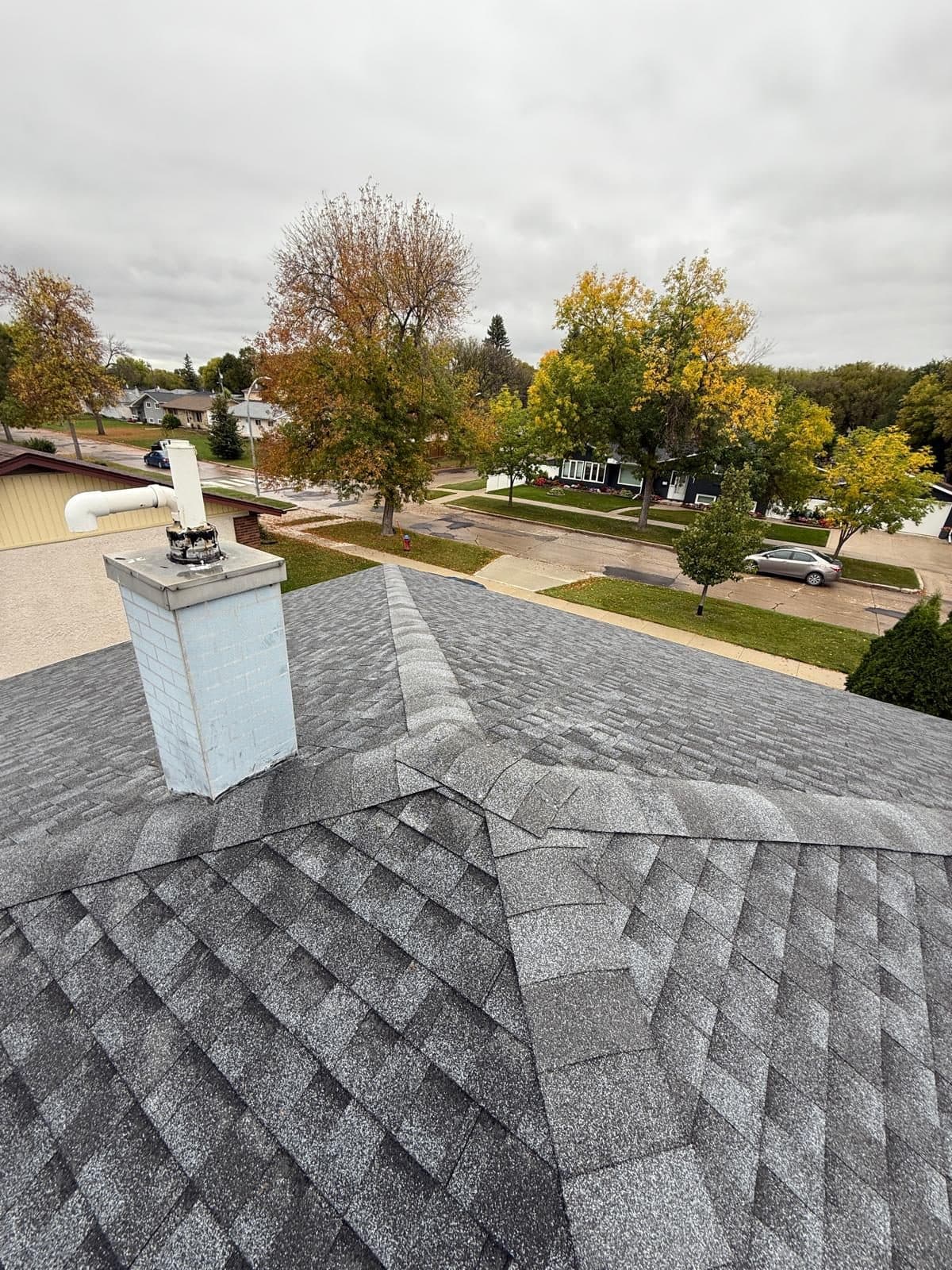 New asphalt roof, neighbourhood view