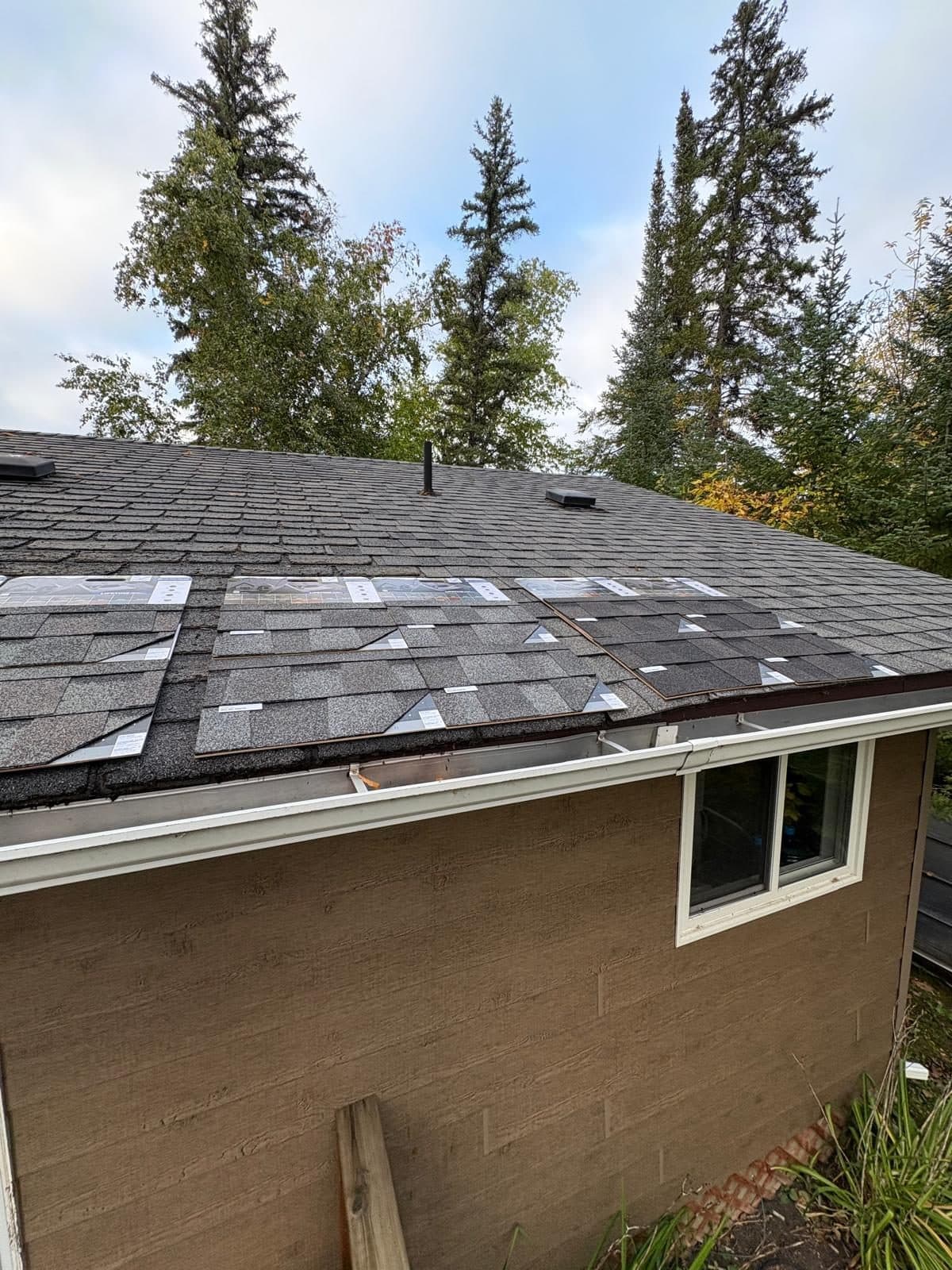 Completed roof replacement on a brick home