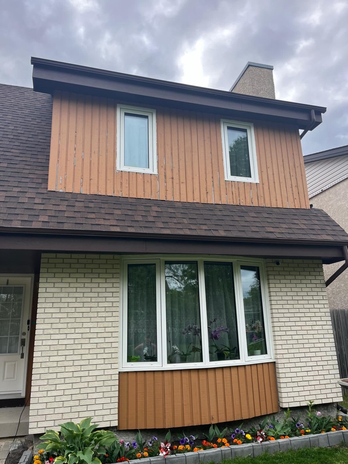 Two-storey Winnipeg home with new roof and siding